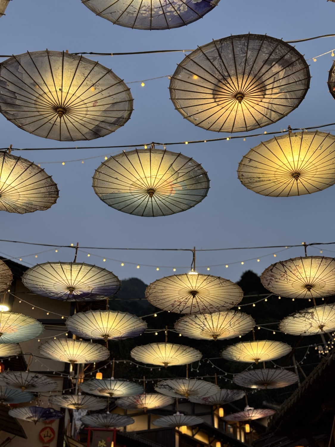 Paper parasols glowing at dusk